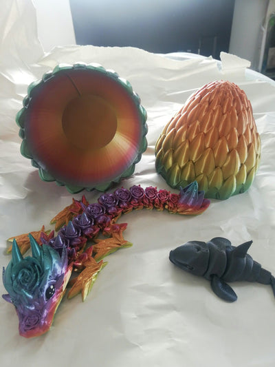 rainbow baby rose dragon with a dragon egg